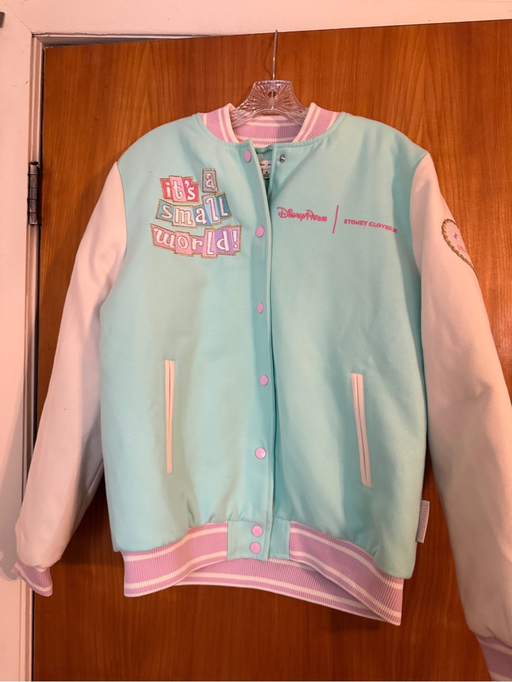 New Disney "It's a Small World" Mint & White Varsity Jacket - size small